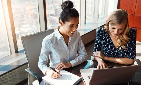 A pair of paralegals working in a downtown law office.