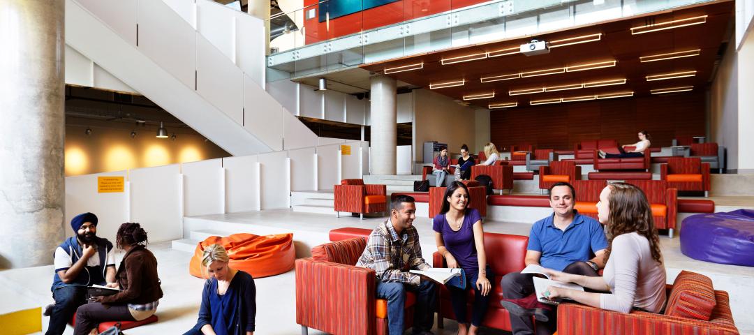 Students lounge in the common area of the Waterfront Campus. 